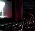 Audiences at the Hammer Museum in Los Angeles use their mobile devices during the simulcast performance.